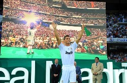 Cristiano Ronaldo's Real Madrid Presentation: Former Manchester United star Cristiano Ronaldo enjoys his Real Madrid presentation. CR9 raises his arms as he salutes the 80,000 supporters that attented this unprecedented event at the Santiago Bernabeu.