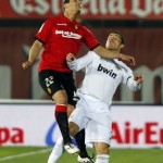 Real Madrid's Cristiano Ronaldo and Mallorca's Cendros challenge for the ball during their Spanish first division soccer match in Mallorca Real Madrid's Cristiano Ronaldo and Mallorca's Cendros challenge for the ball during their Spanish first division soccer match in Mallorca