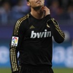 Real Madrid's Ronaldo touches his neck during their Spanish King's Cup soccer match against Malaga in Malaga Real Madrid's Ronaldo touches his neck during their Spanish King's Cup soccer match against Malaga in Malaga