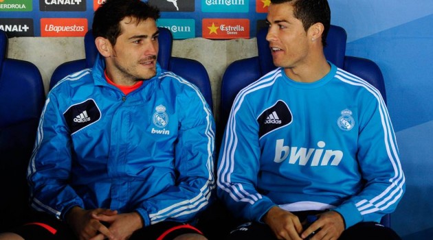 Iker Casillas (L) and Cristiano Ronaldo of Real Madrid CF chat as they sit on the bench during the La Liga match between RCD Espanyol and Real Madrid CF at Cornella-El Prat Stadium on May 11, 2013 in Barcelona, Spain.