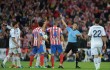 Cristiano Ronaldo (L) of Real Madrid is sent off by referee Carlos Clos Gomez during the Copa del Rey Final between Real Madrid CF and Club Atletico de Madrid at Estadio Santiago Bernabeu on May 17, 2013 in Madrid, Spain.