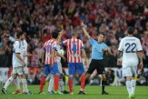 Cristiano Ronaldo (L) of Real Madrid is sent off by referee Carlos Clos Gomez during the Copa del Rey Final between Real Madrid CF and Club Atletico de Madrid at Estadio Santiago Bernabeu on May 17, 2013 in Madrid, Spain.
